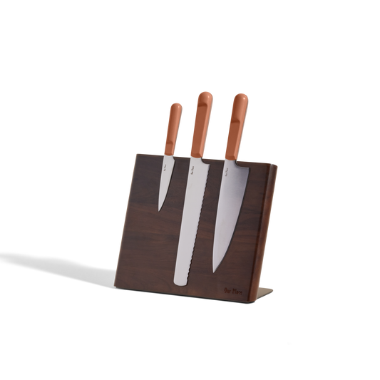 A Knife Trio with brown handles is displayed in a Walnut Knife Block, set against a plain white background.
