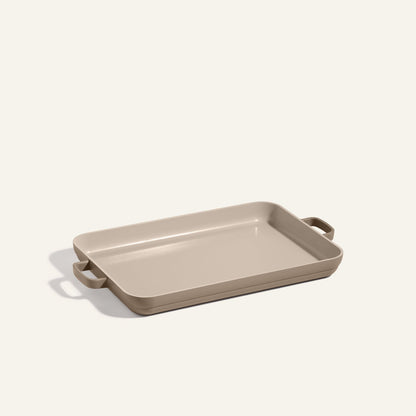 Beige rectangular Griddle Pan with handles on both sides, set on a plain light background—perfect for pairing with your favorite nonstick sheet pan.