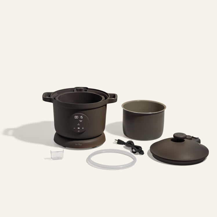 Black dream cooker non toxic pressure cooker with parts laid out