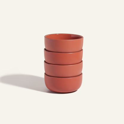 This set of four matte red Soup Bowls, displayed on a plain light background, adds an elegant touch to any modern tableware collection.