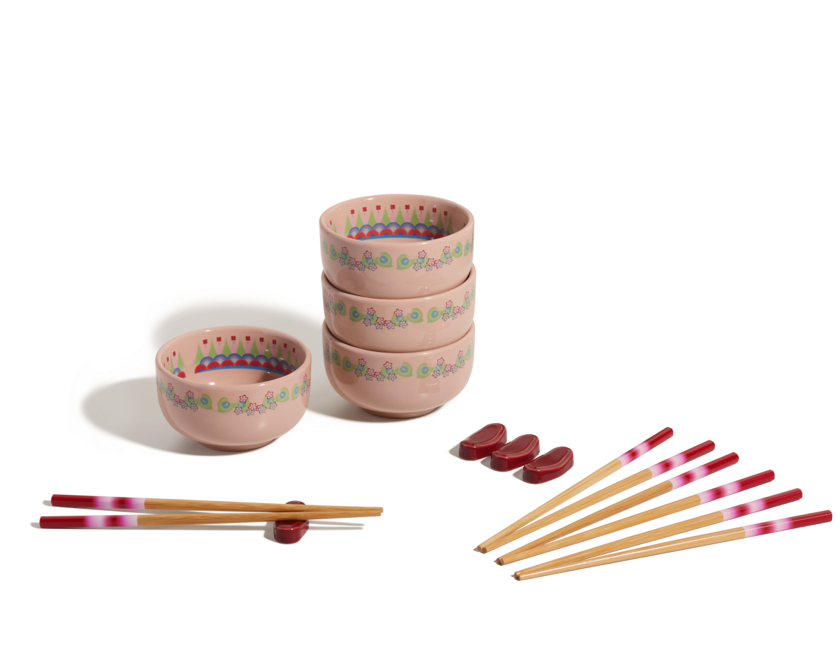 The Rice Bowl Set includes four pink patterned stoneware bowls, matching chopsticks with red and white tips, and red rests—ideal for your Lunar New Year table setting.