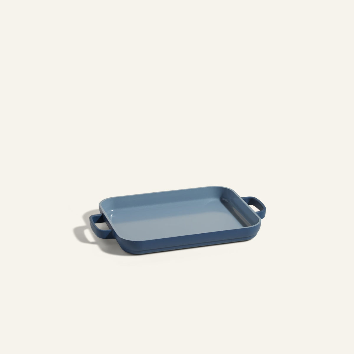 A rectangular blue Mini Griddle Pan with side handles is shown on a plain light background.