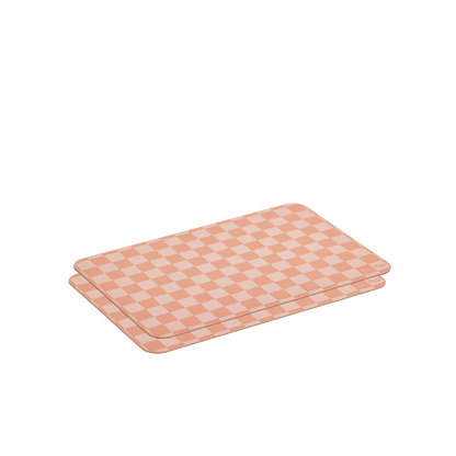 Two rectangular Oven Mats with a peach and cream checkerboard pattern are stacked on a white background.