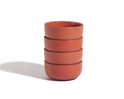A set of four matte reddish-brown stackable Soup Bowls on a white background, ideal for enhancing your tableware collection.