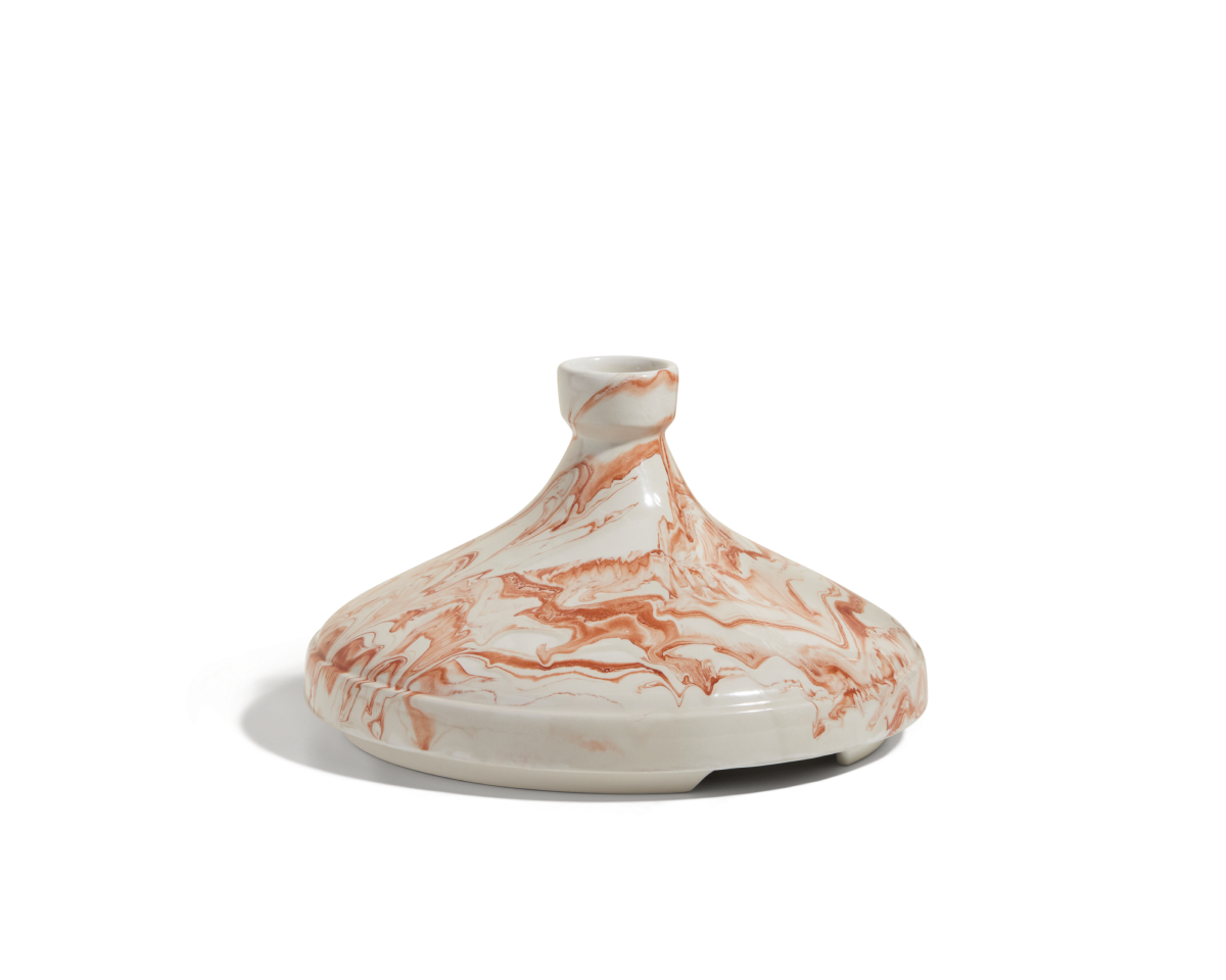 A handcrafted small clay Tagine lid featuring a marbled white and reddish-brown pattern, made in Morocco, shown on a white background.