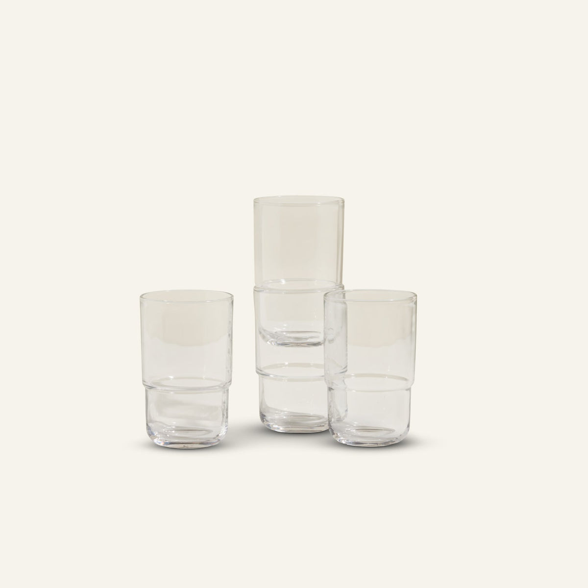 Four Tall Night + Day Glasses are arranged against a light background, with two 16 oz tumblers stacked and two standing separately in a minimalistic stackable display.