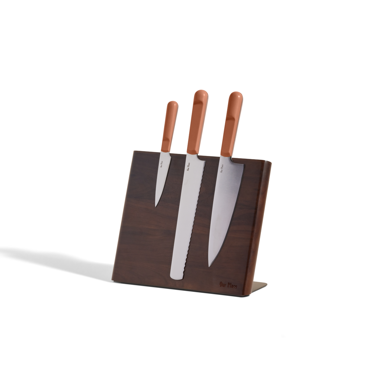 A Knife Trio with brown handles is displayed in a Walnut Knife Block, set against a plain white background.