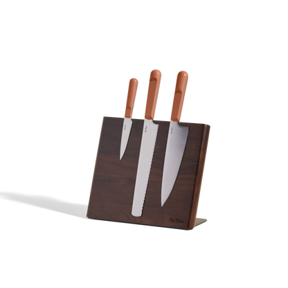A Knife Trio with brown handles is displayed in a Walnut Knife Block, set against a plain white background.