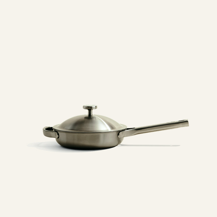 A Titanium Always Pan Pro 8.5″ 2.0 stainless steel pan with a matching lid, a long handle, and a small side handle.