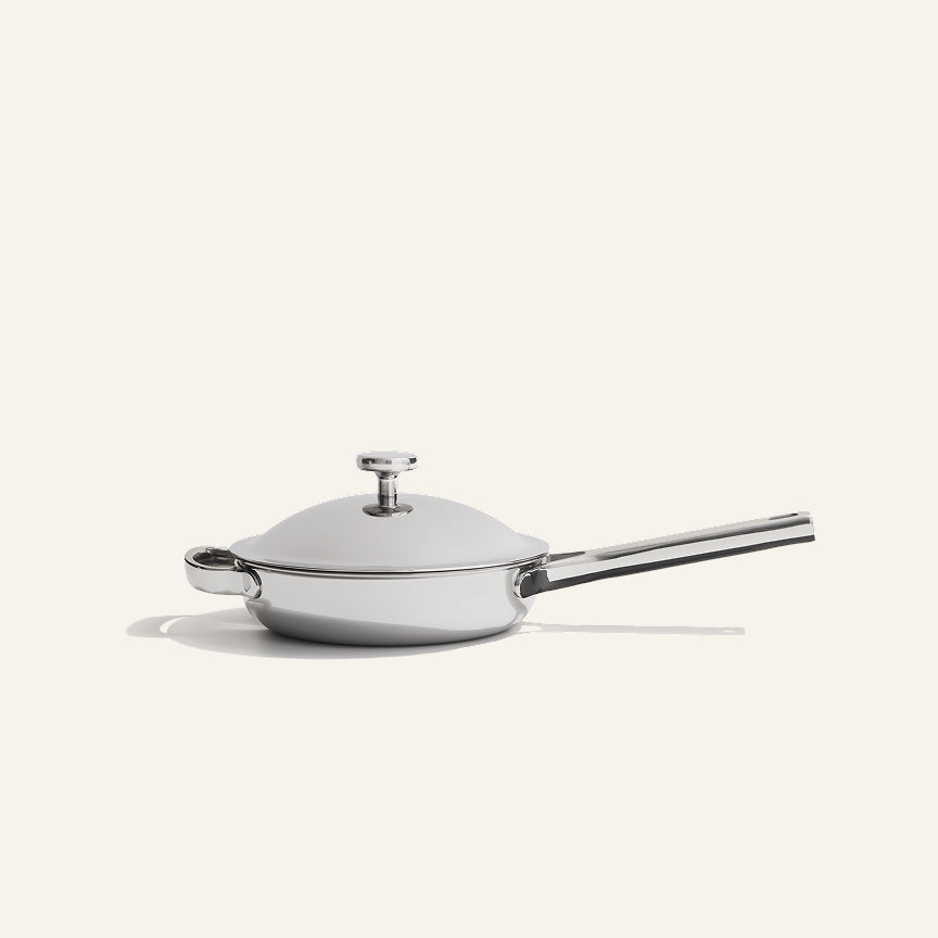 A non-toxic stainless steel Titanium Always Pan Pro 8.5″ 2.0 frying pan with a matching lid and a long handle.
