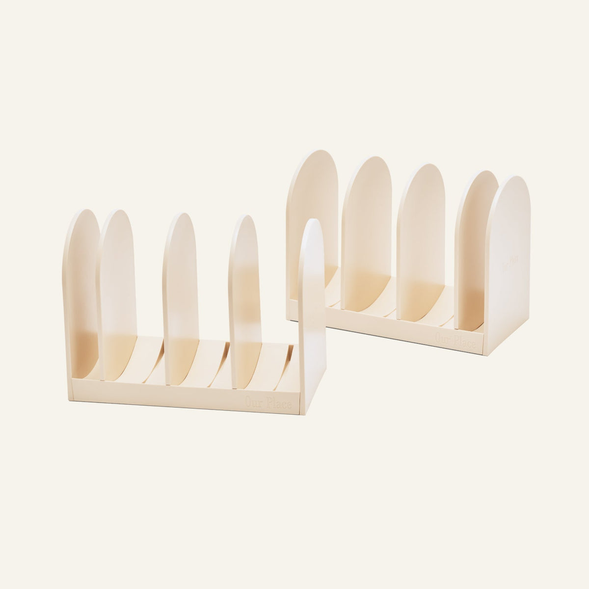 Two light-colored Universal Storage modular racks for cookware with rounded dividers.