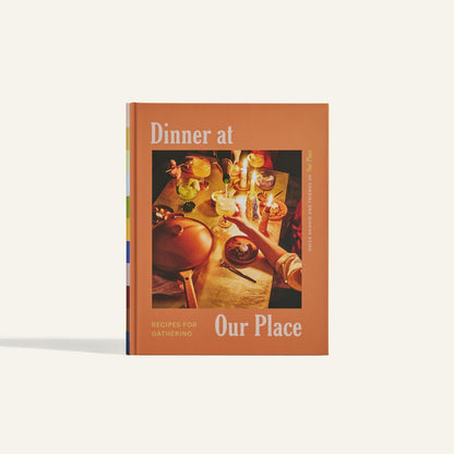 Dinner at Our Place is a cookbook by Shiza Shahid, featuring recipes for gatherings and an inviting cover with a meal table setting.