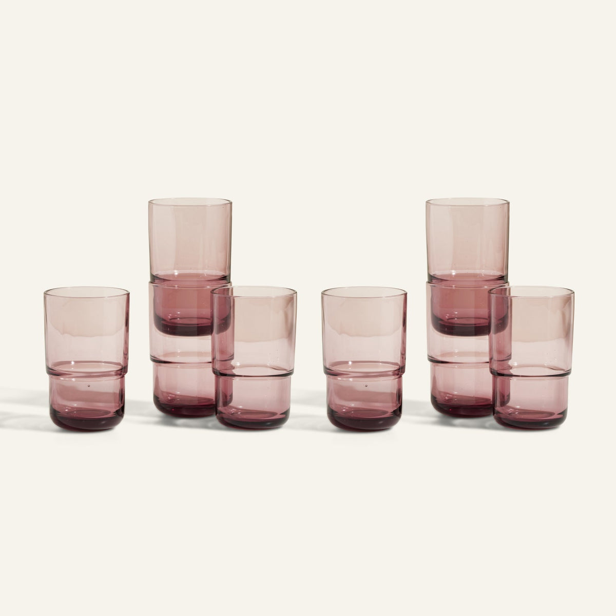 Seven Tall Night + Day Glasses in clear mauve, each 16 oz, are displayed in two stacks of two and three singles against a plain light background.