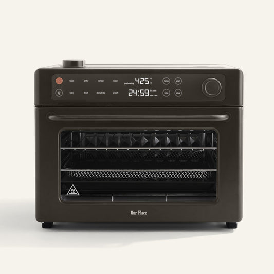 Black oven with digital display on a white background