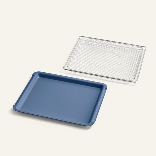 Blue baking tray with a silver mesh rack on a white background